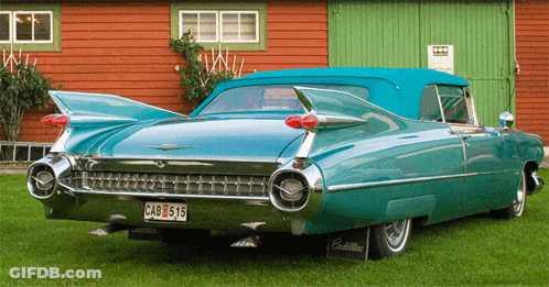 A Green Cadillac With A License Plate That Says Cab 515 GIF