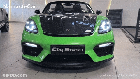 A Green Car With The Word Car Street On The Front Of It GIF