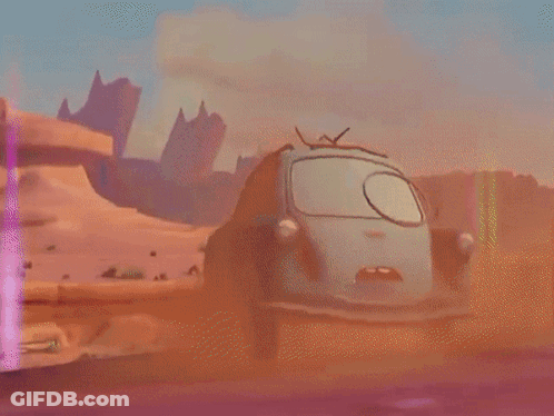 A Green Cartoon Car Is Driving Down A Road With Mountains In The Background GIF