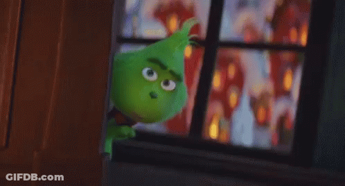 A Green Cartoon Character Is Standing In Front Of A Window Looking Out . GIF