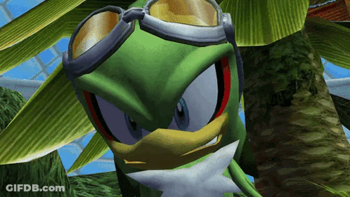 A Green Cartoon Character Wearing Goggles Is Looking At The Camera GIF