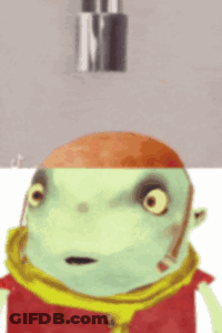 A Green Cartoon Character With A Red Hat And Scarf Looks Surprised GIF