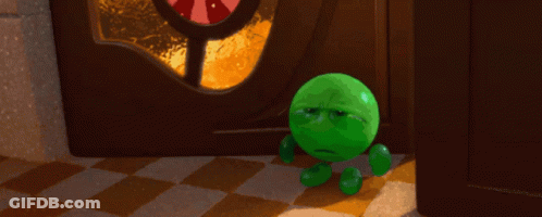 A Green Cartoon Character With A Sad Face Stands In Front Of A Door GIF