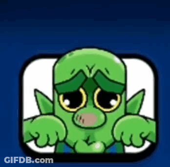 A Green Cartoon Character With A Sad Look On His Face Is Sitting In A Square . GIF
