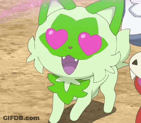 A Green Cat With Pink Heart Shaped Eyes And A Green Leaf On Its Face GIF