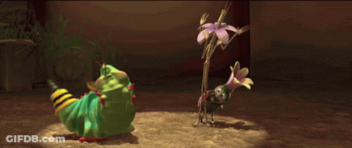 A Green Caterpillar Is Standing Next To A Small Bug GIF
