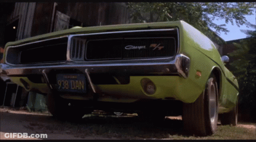 A Green Dodge Charger With A California License Plate GIF