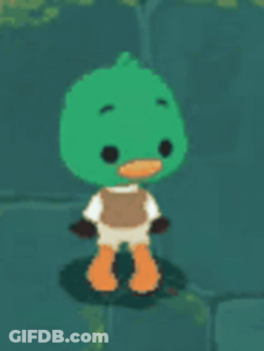 A Green Duck With Orange Feet And A White Shirt Is Standing On A Rock . GIF