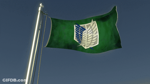 A Green Flag With A Blue Shield On It Is Flying In The Wind GIF
