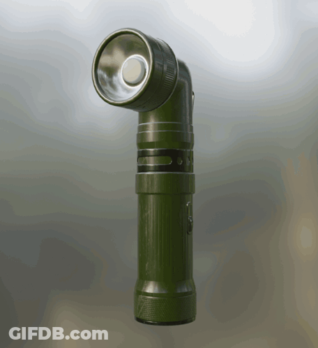 A Green Flashlight Is Sitting On A Table GIF