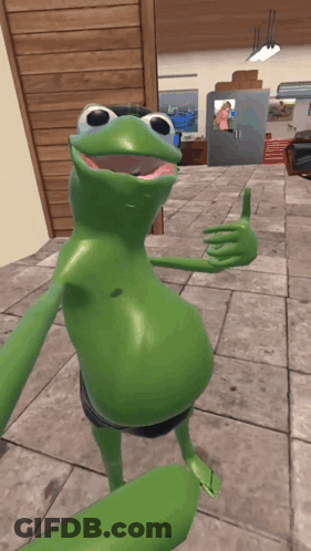 A Green Frog Is Giving A Thumbs Up In A Room GIF