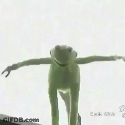 A Green Frog Is Standing On Top Of A Building In The Rain GIF