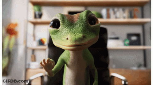 A Green Gecko Is Sitting In An Office Chair And Waving GIF