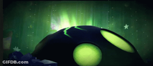 A Green Glowing Object In A Dark Room GIF