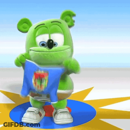 A Green Gummy Bear Is Holding A Blue Shirt That Says ' Gummy Bear ' On It GIF