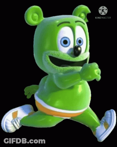 A Green Gummy Bear Is Running On A Black Background . GIF