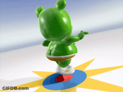 A Green Gummy Bear Is Standing On A Blue And Red Circle GIF