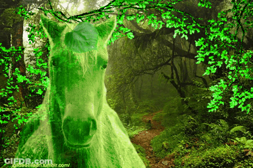 A Green Horse With A Leaf On Its Head Is In A Lush Green Forest GIF