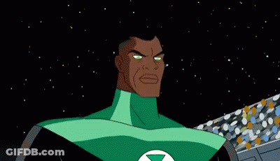 A Green Lantern Symbol Is Glowing In The Dark On A Blue Background . GIF