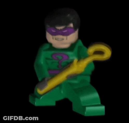 A Green Lego Figure With A Purple Mask And A Yellow Cane GIF