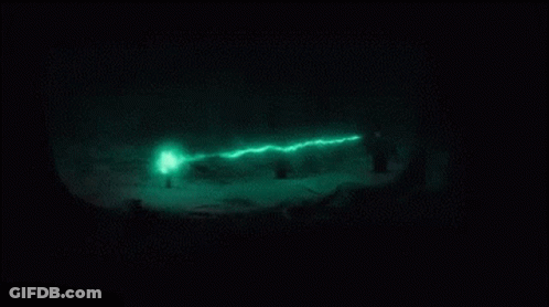 A Green Light Is Shining On A Black Surface GIF