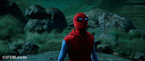 A Green Light Is Shining On A Person In A Dark Room GIF