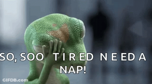 A Green Lizard Is Covering Its Face With Its Hands And The Words So Soo Tired Need A Nap GIF