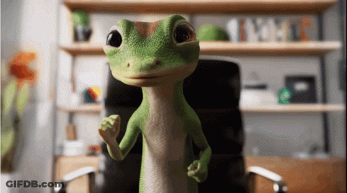A Green Lizard Is Standing In Front Of A Desk And Chair GIF