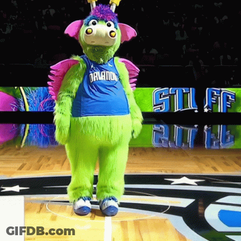 A Green Mascot Wearing A Blue Jersey That Says Orlando GIF