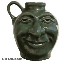 A Green Pitcher With A Smiling Face On It GIF