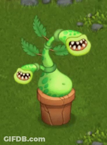 A Green Plant In A Pot With Its Mouth Wide Open GIF