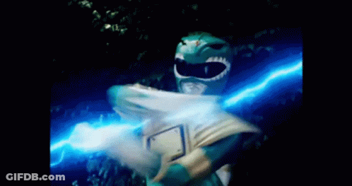 A Green Power Ranger Is Holding A Blue Light In His Hands GIF