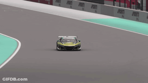 A Green Race Car Is Driving On A Track With Priority Written On The Side GIF