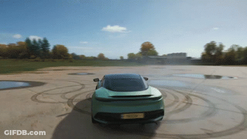 A Green Sports Car With A License Plate That Says ' A ' GIF