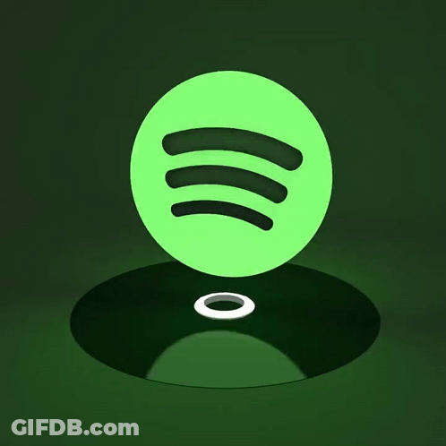 A Green Spotify Logo Sits On A Record GIF