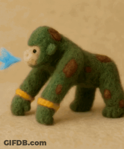 Green Stuffed Gorilla With Brown Spots GIF