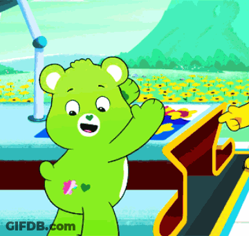 A Green Teddy Bear With A Pink Heart On Its Butt GIF