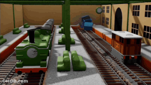 A Green Train With The Number 7 On The Front GIF
