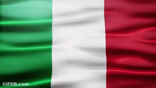 A Green White And Red Flag Is Flying In The Wind GIF