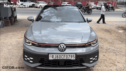 A Grey Volkswagen Car With A License Plate That Says Rj60cf075 GIF