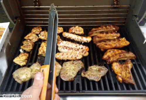 A Grill With A Lot Of Meat On It GIF