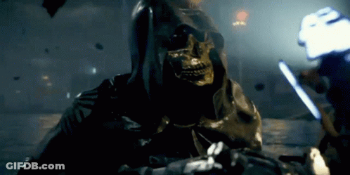 A Grim Reaper With A Skull On His Face Is Holding A Sword GIF