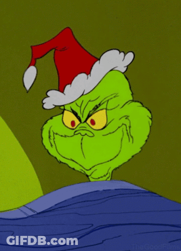 A Grinch Cartoon With A Santa Hat On His Head GIF