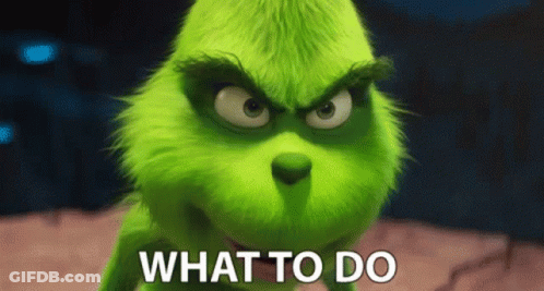 A Grinch From The Movie The Grinch Is Asking What To Do . GIF