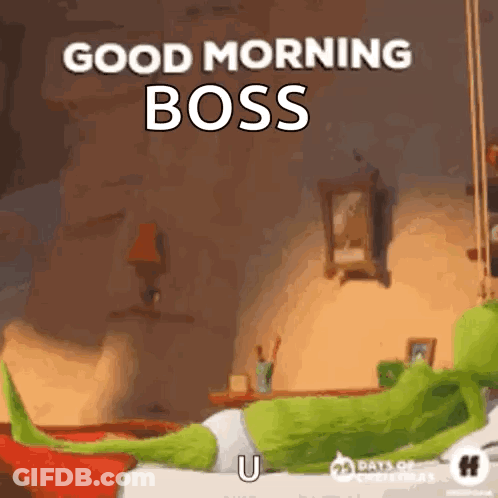 A Grinch Is Laying On A Bed With A Good Morning Boss Greeting . GIF