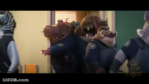 A Group Of Animals Dressed As Police Officers Are Standing In A Room . GIF