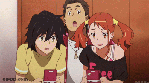 A Group Of Anime Characters Are Looking At Their Phones And One Of Them Is Wearing A Shirt That Says Free GIF