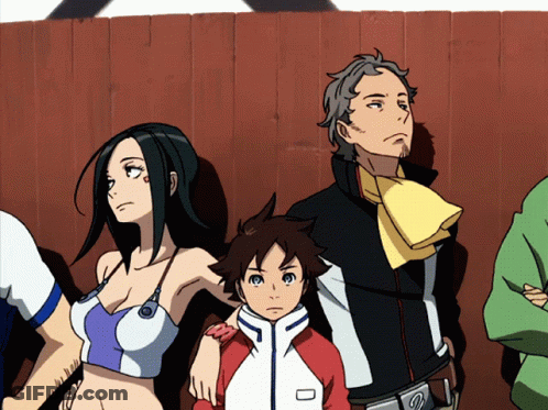 A Group Of Anime Characters Are Standing In Front Of A Fence GIF