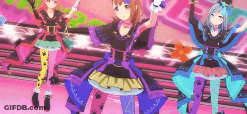 A Group Of Anime Girls Are Dancing On A Stage . GIF