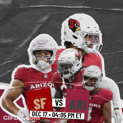 A Group Of Arizona Football Players Holding Up A Sign That Says Sf Vs Ari GIF